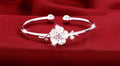 Stainless Steel bangle-cuff with white flower